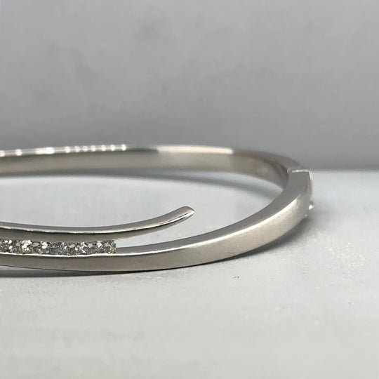 18ct White Gold Diamond Set Bangle (c. 0.10 - 0.15ct)